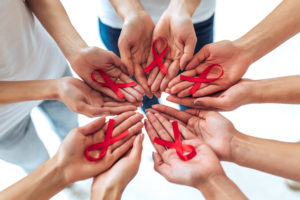 hands with ribbons banner