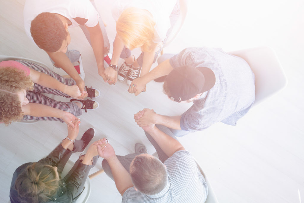 Young people holding hands